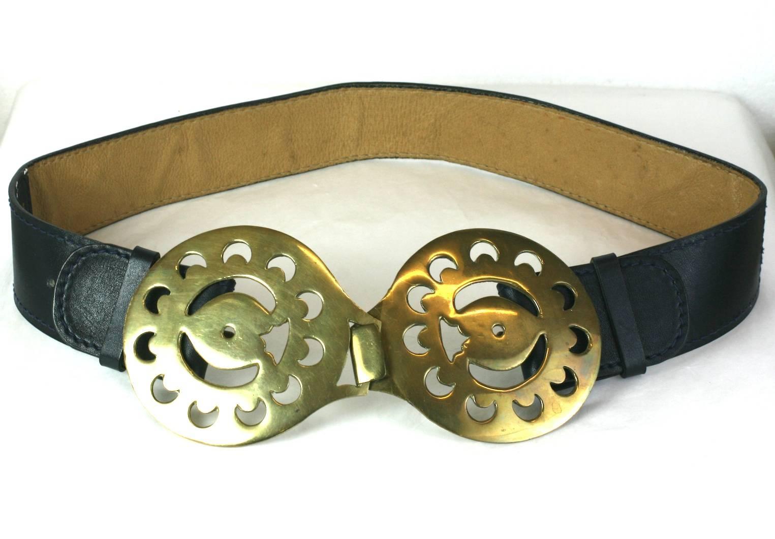 Gherardini mod navy calf belt with massive pierced brass buckle from the 1970's, Italy.  Adjustable to wear at waist or at hip. 
 Buckle 7.75