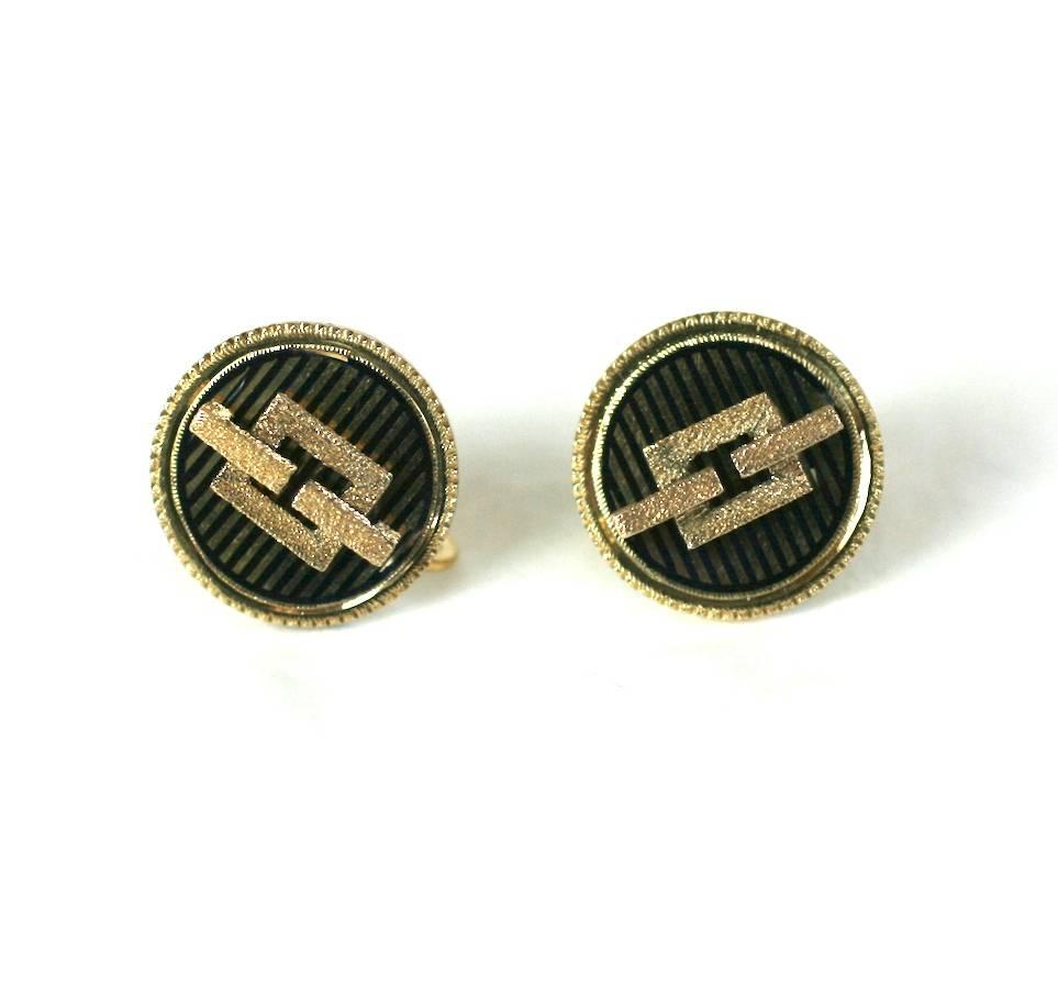 Simple and striking Victorian earrings with black enamel stripes with an applied textured, architectural link motif, all set in 14k gold. The earring backs have been replaced with gold filled screw back fittings at a later date. 1880's