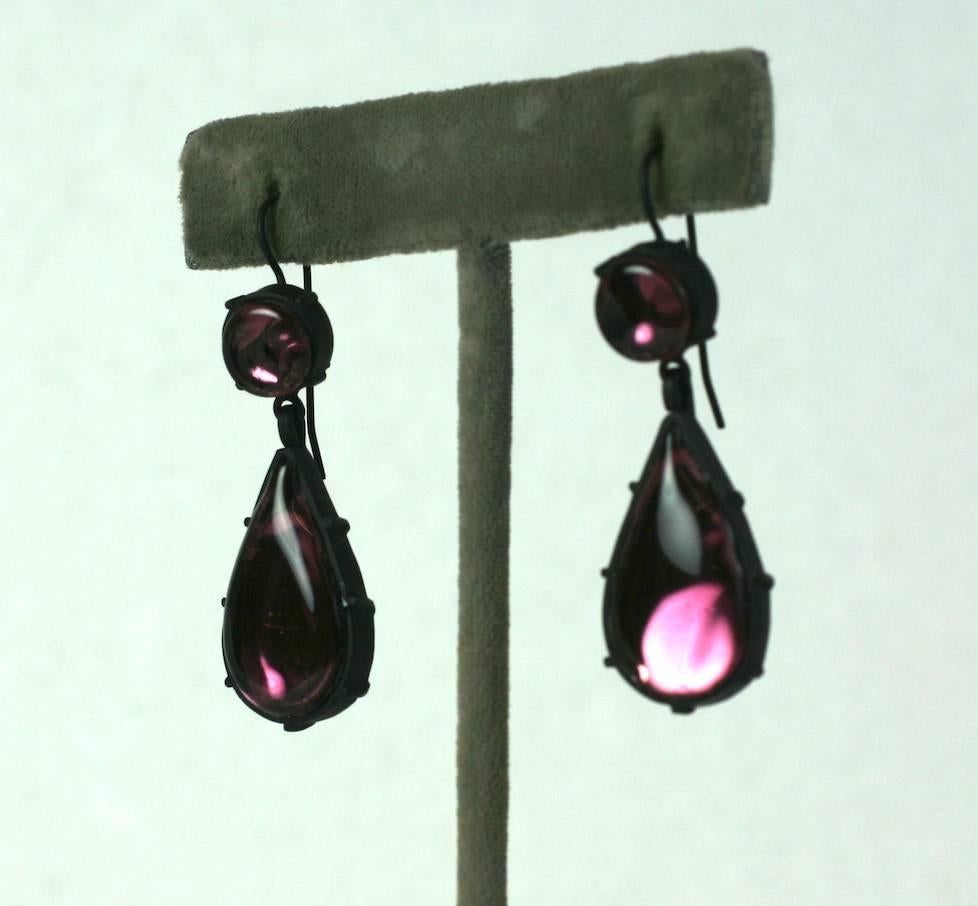 Amythest  Foiled Drop Earrings from the Parisian studios of MWLC. Elegant drop earrings in amythest pate de verre with inserted foils made in Georgian style, closed settings.
The color pops against the blackened metal finish and the foils inside