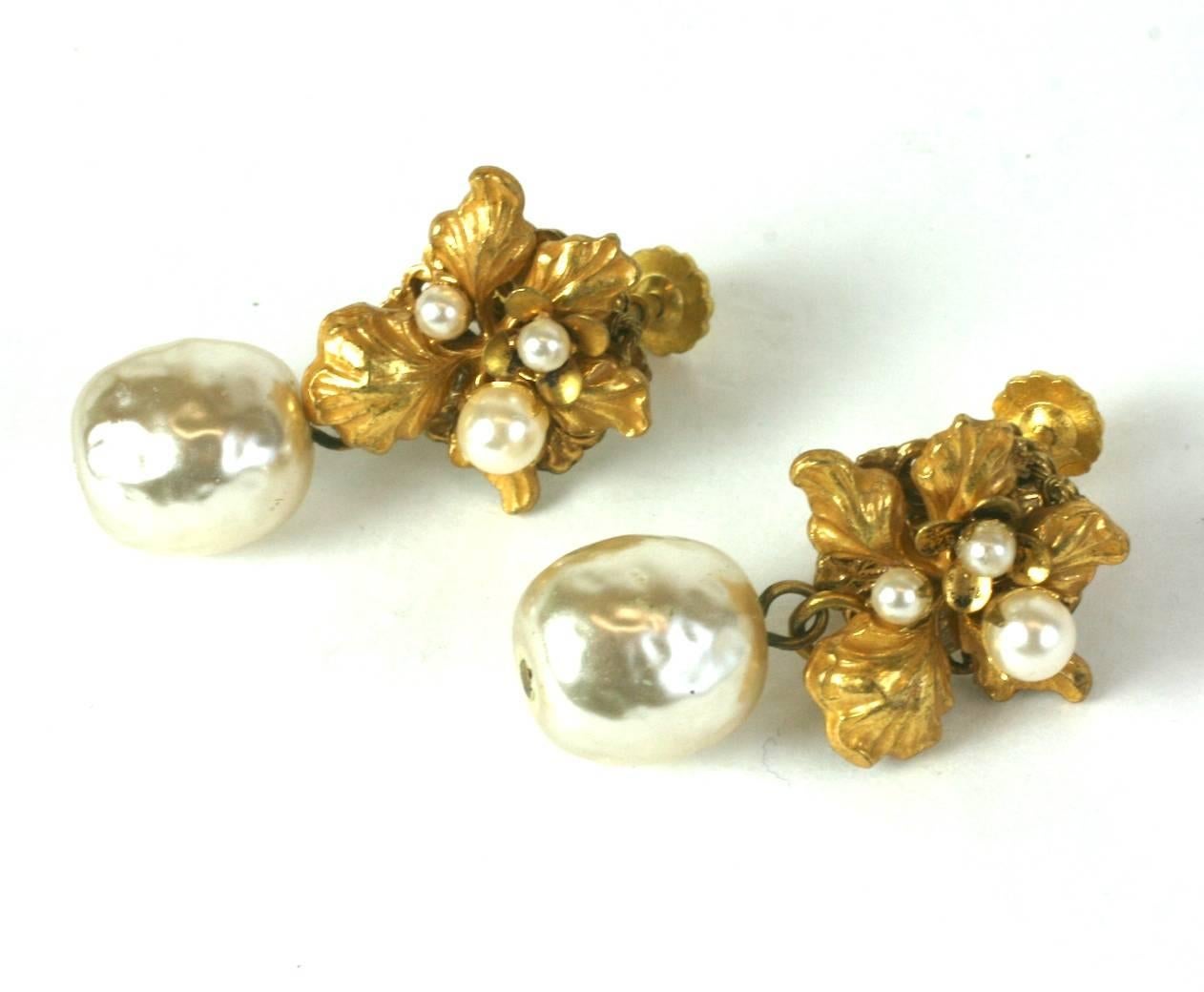 Miriam Haskell gilded Iris and faux pearl earrings in signature Russian gilt. Clip back fittings. Excellent condition. 1950's USA. 
1.5" x .75" wide. Pearl approx 10mm across. 