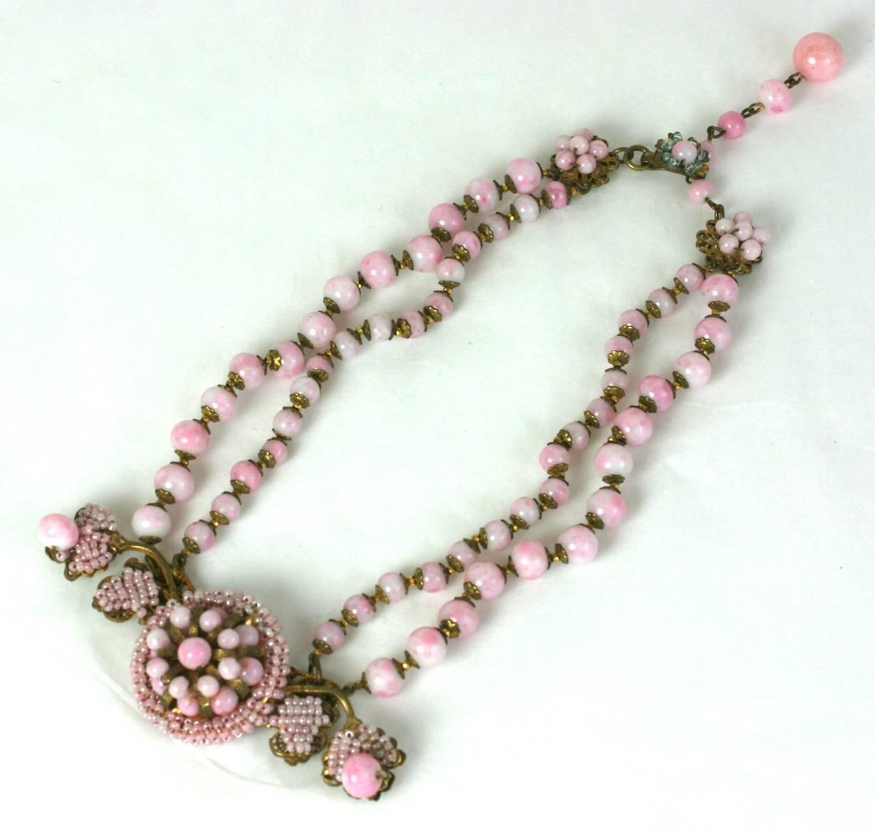 Miriam Haskell Victorian Revival necklace of faux angel skin pate de verre, round and seed beads. Set onto signature Russian gilt filigrees with intricate hand sewn details. 1940's USA.
Excellent condition. 
L 14