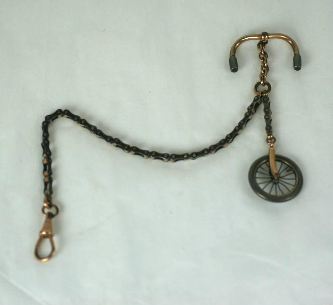 Victorian Novelty Bicycling Fob Chain from the late 19th Century. Victorians became obsessed with the sport of bicycling which helped spawn an industry of novelty items geared to the gentleman-sportsman. 
Here a fob chain (for holding a pocket