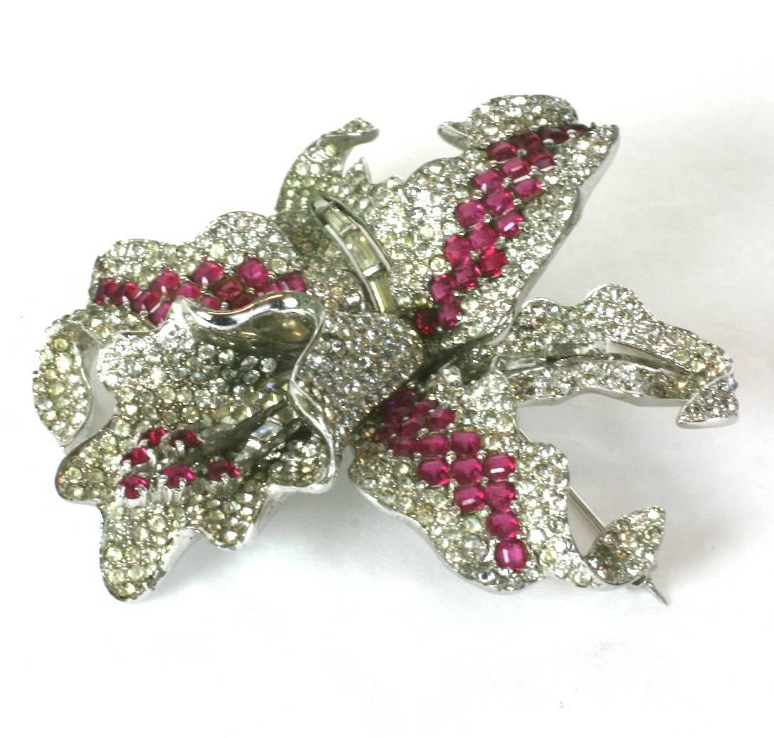 Extraordinary Marcel Boucher Early Orchid Brooch from the late 1930's. Dimensional and large brooch with amazing design and signature square cut faux ruby stones used primarily by Boucher. This brooch is designed in pieces and assembled like fine