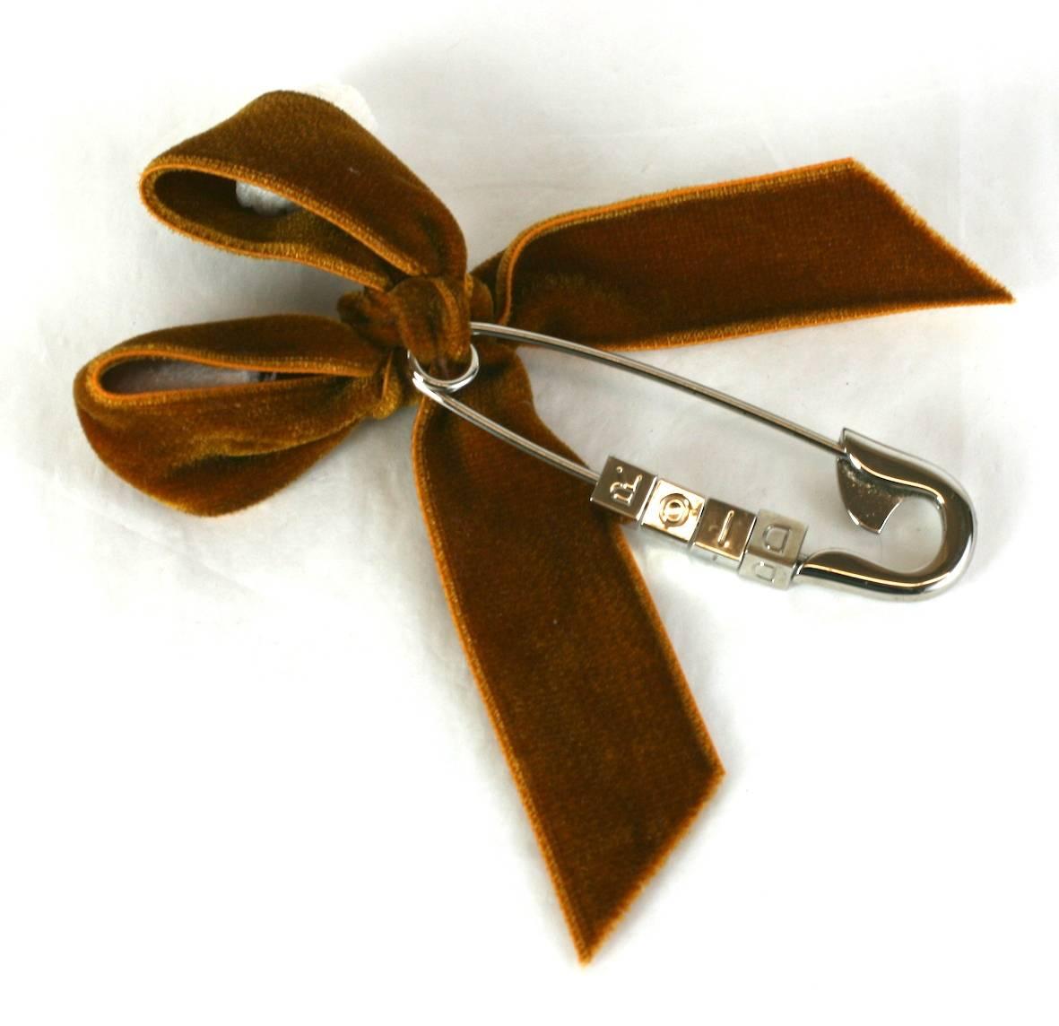 Christian Dior Logo Safety Pin Brooch with deep pumpkin velvet bow. 