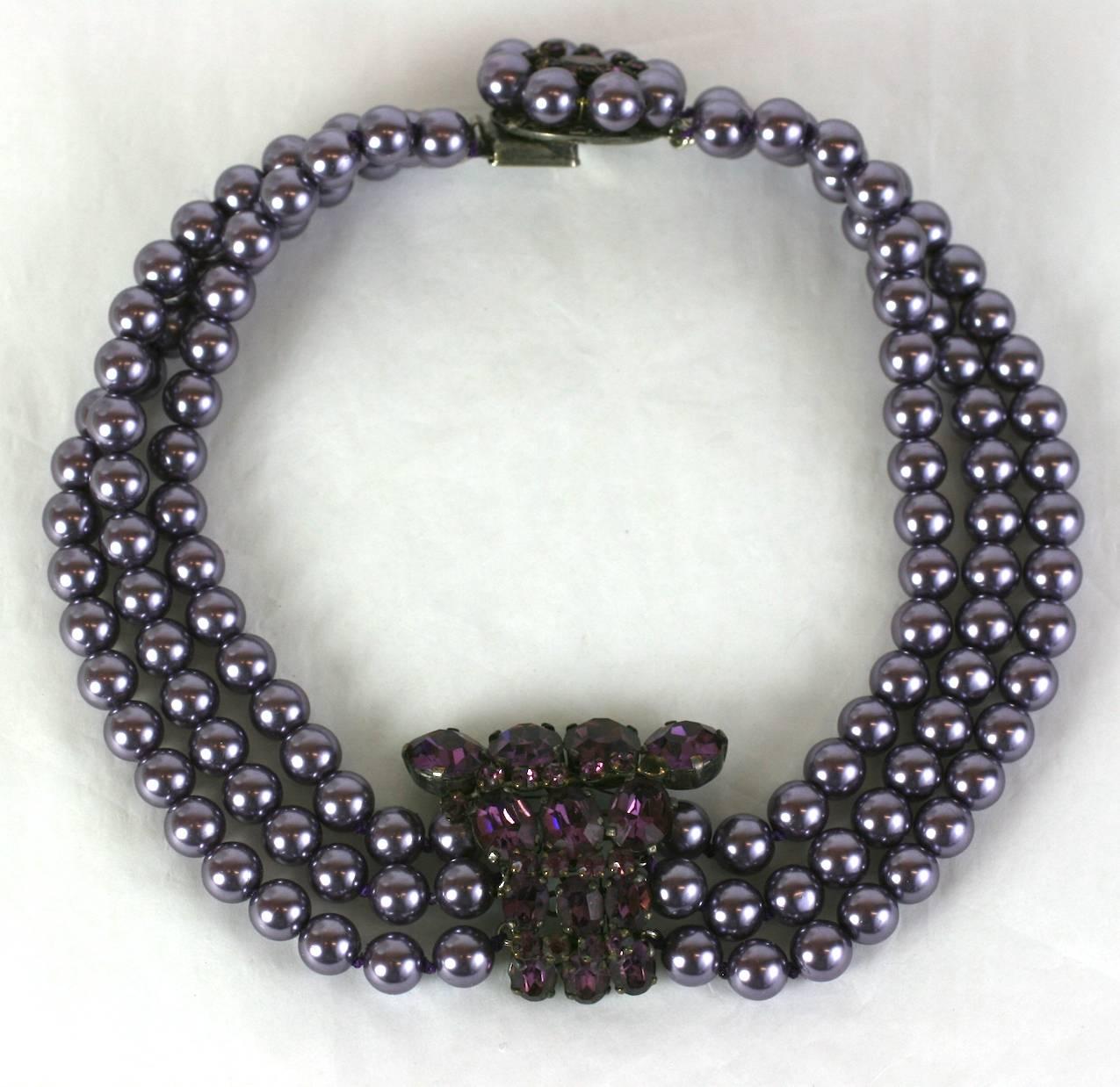 Elegant French Pearl Collar choker with 3 rows of purple faux pearls with central jeweled station and clasp. 1950's France. 
Shortest length (highest strand), 13.5