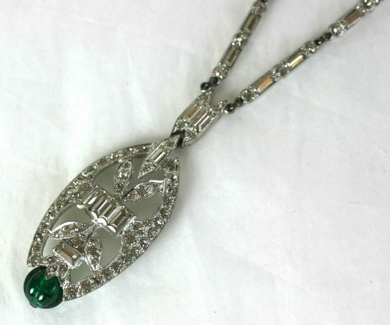 Faux Emerald Bead Deco Pendant from the 1920's. Pave rhinestones and baguettes are set into white metal with a fluted faux emerald bead at base of pendant. 1920's USA.
Excellent condition. 
Length 16