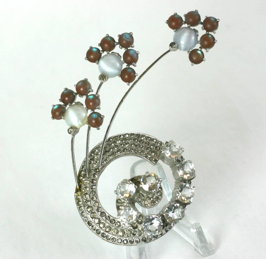 Unusual dimensional Reja crystal pave Retro swirl brooch incorporating Czechoslovakian Saphiret glass cabochons and faux moonstones. Large amazing scale. 
Unsigned. Excellent condition. 
4.5