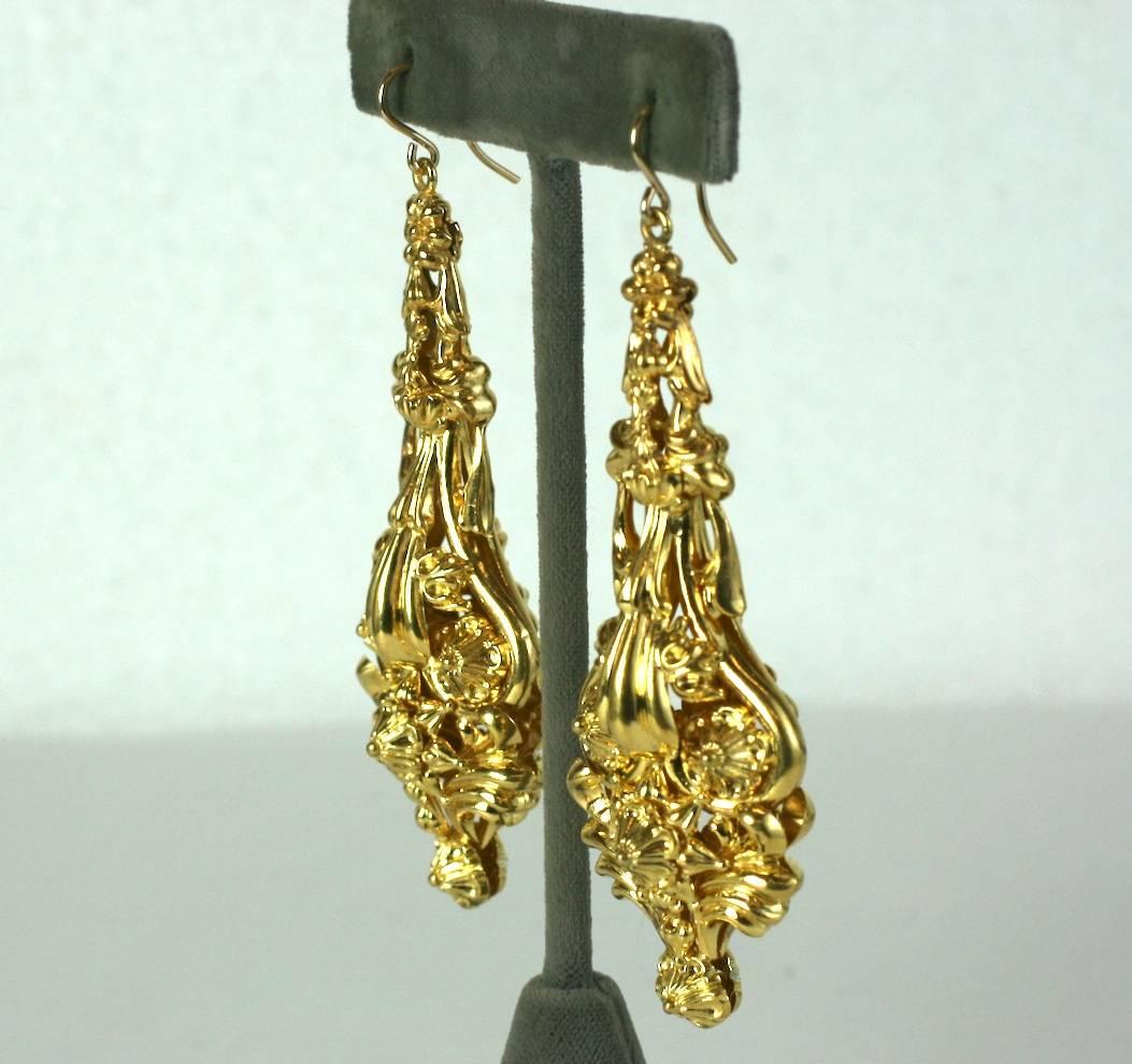 Early 19th Century Massive Earrings with high repousse scroll work with floriform embellishments. Lightweight and hollow openwork construction for these amazing, oversized period earrings. 
3