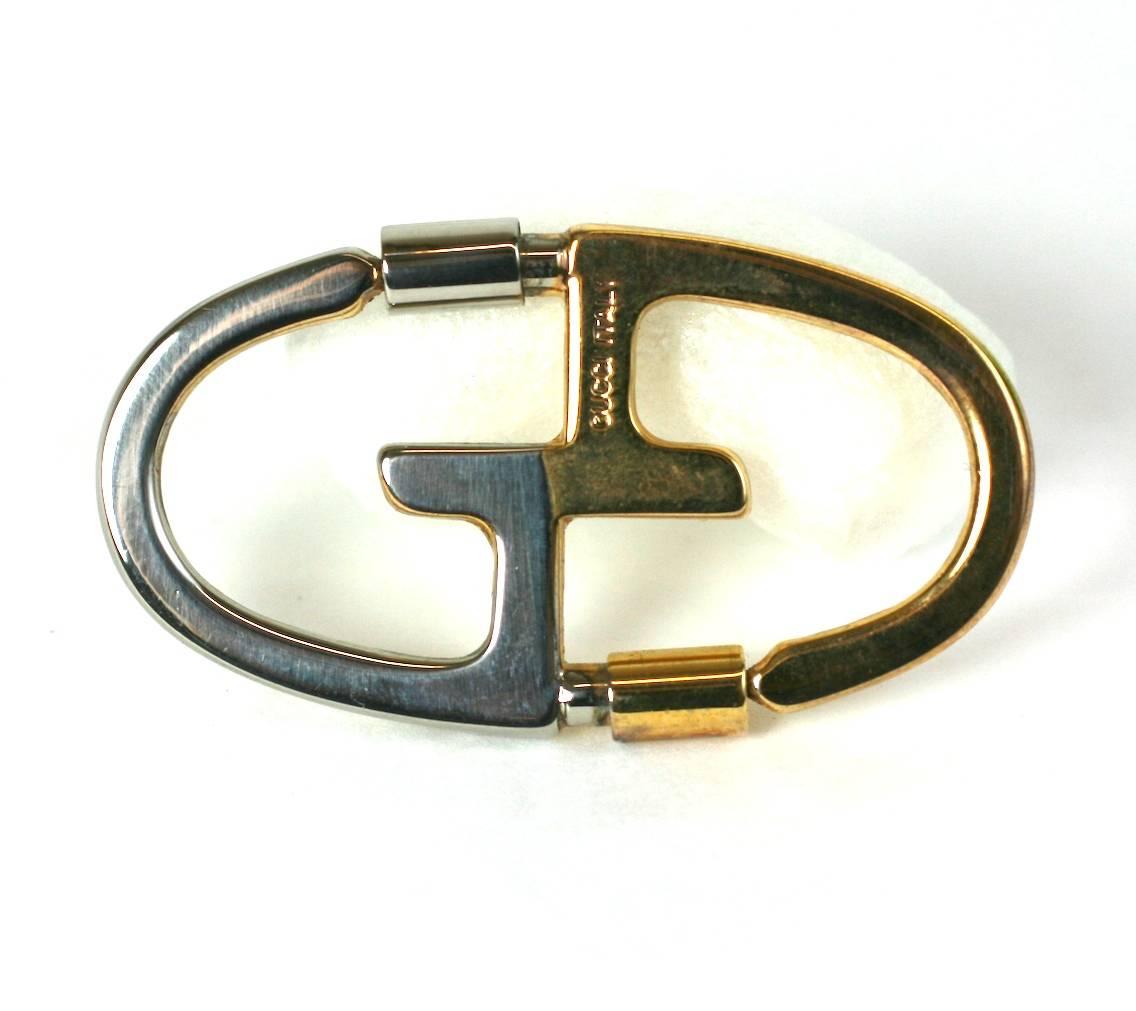 Gucci 2 Tone Key Ring in gilt and silver gilt. Pressure clips (2) allow keys to be attached and removed easily. 
1970's Italy.  Excellent condition. 