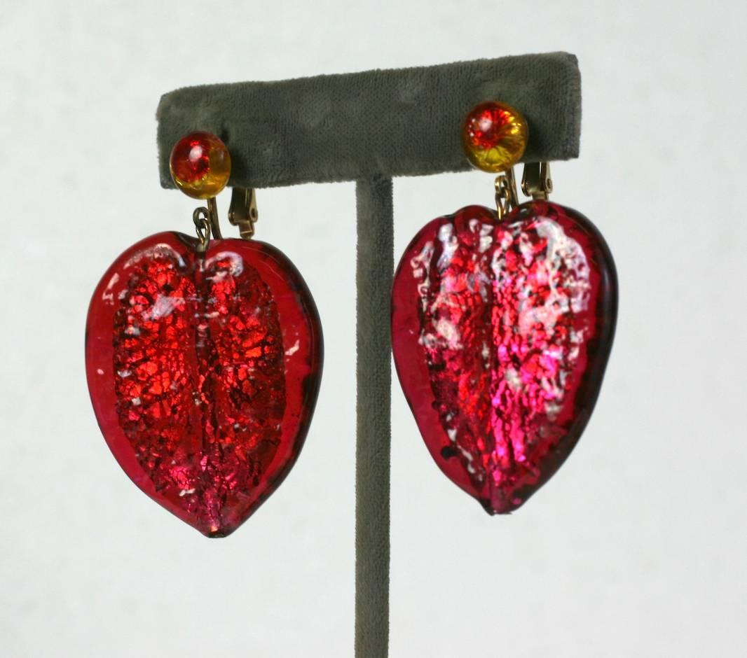 Huge Murano leaf assembled earrings made by Studio VL. Large ruby glass leaf beads with silver foiled interiors from Italy (1950's) are perfectly matched to dichrotic glass cabochons, made in Japan in the 1930's. Very nice effect. Clip back