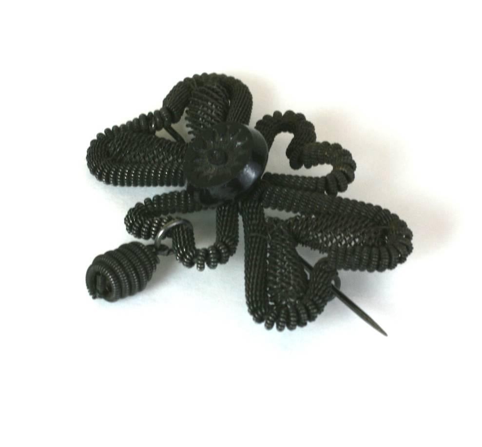 Silesian Wirework Bow Brooch from the Georgian period, circa 1830's. Intricately woven iron wire is formed into a bow formed brooch with drop and gutta percha button decoration. 2