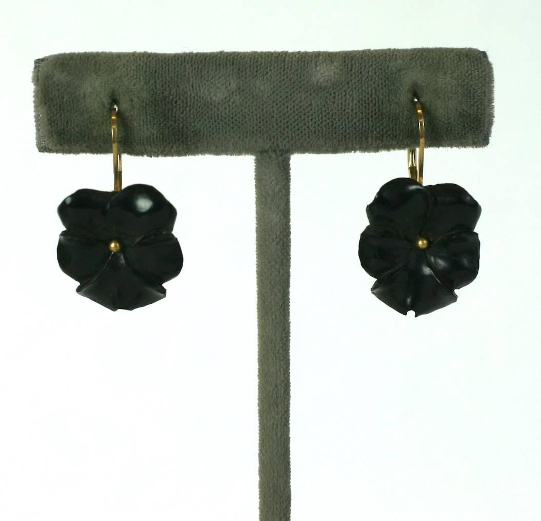 Victorian Gutta Percha Pansy Earrings from the late 19th Century. Finely carved with central gold bead and contemporary pierced ear fittings. .75