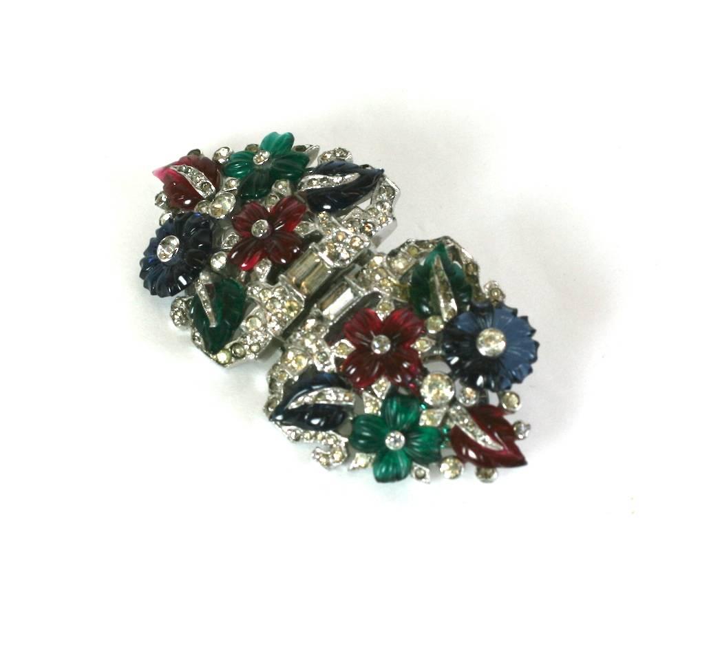 Mazer Tutti Frutti dress clips duette brooch of tricolor fruit salad flowers and leaves, set within fine crystal pave. Clips can be removed from frame to wear separately as a pair or combined, as a striking brooch. 1930's USA.
Excellent Condition.