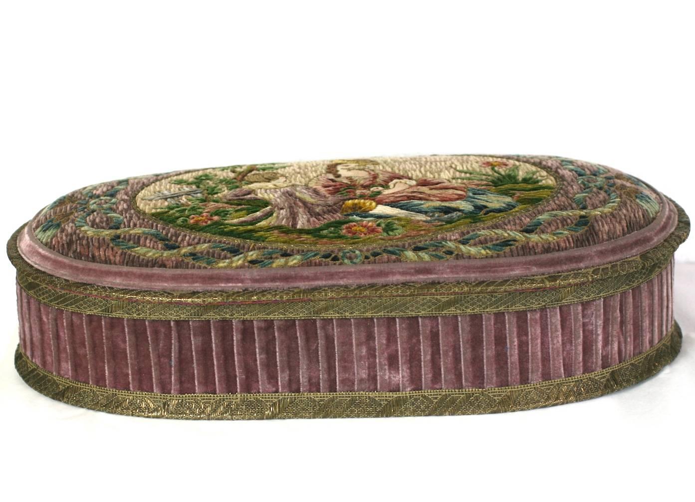 Wonderful  Deco French Boudoir Box with hand stitched chenille embroidery. A pastoral scene with a couple lounging in the grass is beautifully rendered in colorful silk yarns and trimmed in antique gold lame tape. A twisted rope motif with tassels
