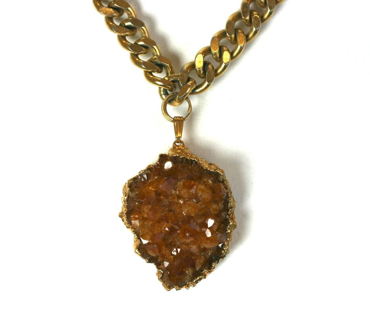 Attractive Citrine Geode Pendant from the 1960's. A citrine crystal is suspended from a gilt curb link chain. 1960's USA. Excellent condition. 
Chain 15" x .33". Pendant 1.5" x 1". 