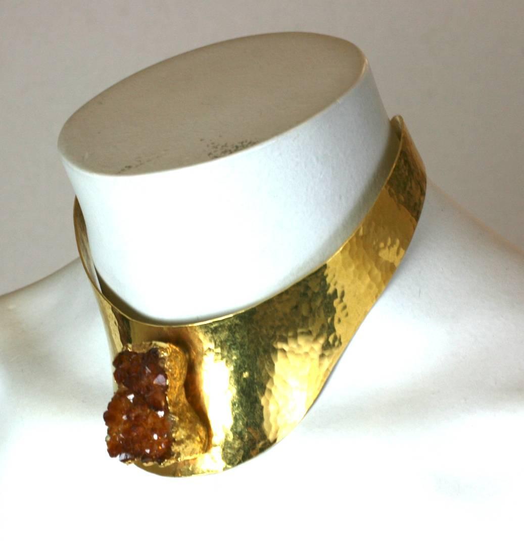 Unique Pauline Trigere Citrine Geode Collar from the 1960's. This hand hammered brass collar, was custom crafted in Denmark to her modernist design. A raw citrine crystal forms the centerpiece. 1960's USA/Denmark.  Excellent condition. 
Small size.
