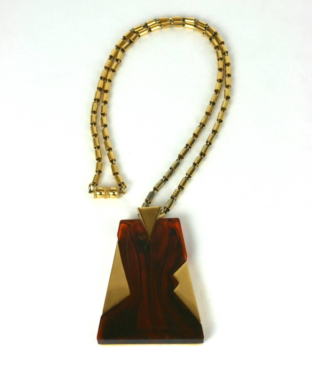 Trifari Art Deco Style Pendant in bakelite and gilt metal. Art Deco styling with barrel link chain. 1970's USA.
Excellent condition. 
Pendant 3