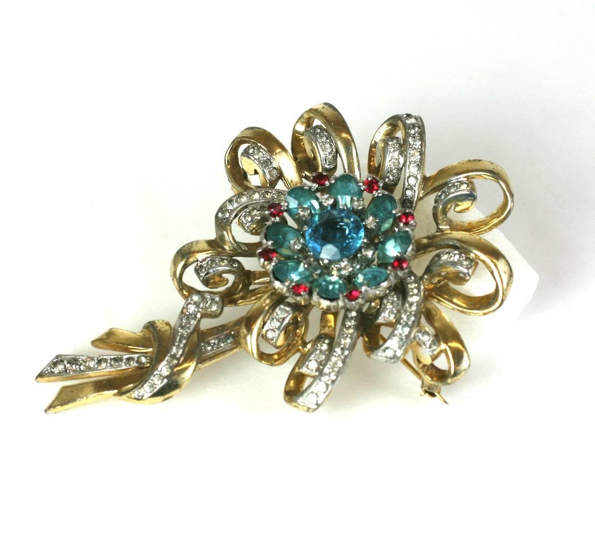 Large and striking Ciner Retro floral spray brooch of gold plated metal, crystal pave with focal faux aquamarine and ruby flower head. Strong dimensional design, signed, Ciner. 1940's USA. 
Excellent Condition. L3.50