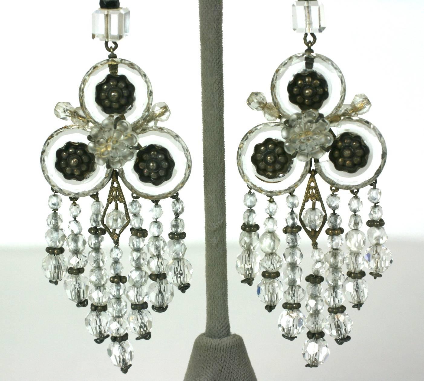 Amazing Art Deco Rock Crystal Fringe Earrings set in gilded silver. Wonderful and unusual design with fringes of rock crystal beads falling from 3 faceted crystal donuts with floral centers. A large molded glass flower centers each earring.