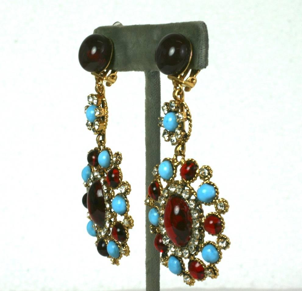 Elaborate and elegant Maison Gripoix Poured Glass earrings from the 1980's. Large scaled in vibrant contrasting tones of ruby and turquoise glass in a Baroque design set with crystal pastes throughout. All Gripoix manufacture from this period was