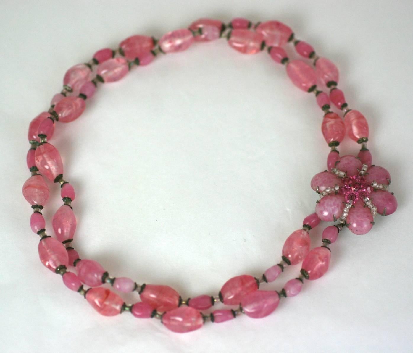 Miriam Haskell Pink Pate de Verre Bead Necklace with floral clasp. Mottled pink pate de verre beads are used with crystal spacers and a hand sewn beaded clasp. 1950's USA. 
15.5