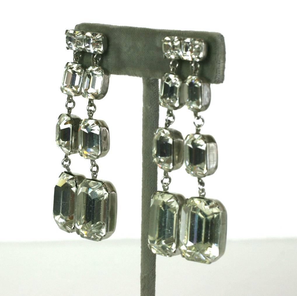 Glamorous Rhinestone Drop Earrings, Vogue, NY.  Emerald cut pastes are used in different configurations for this strikingly modern design. 1950's USA. Clip back fittings. Excellent condition. 
2.5" in length, .6" on ear to 1" width at