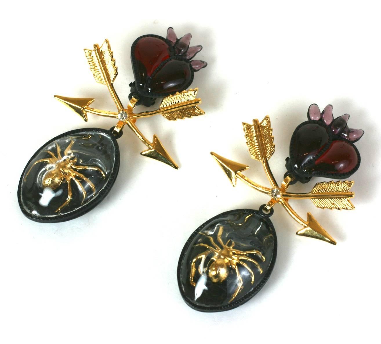 Long flaming Sacred Heart Earrings with Antique overtones in a modern mash up of styles and periods. Poured glass hearts in ruby and amythest glass are paired with gilt arrows and a Georgian style caged spiders 