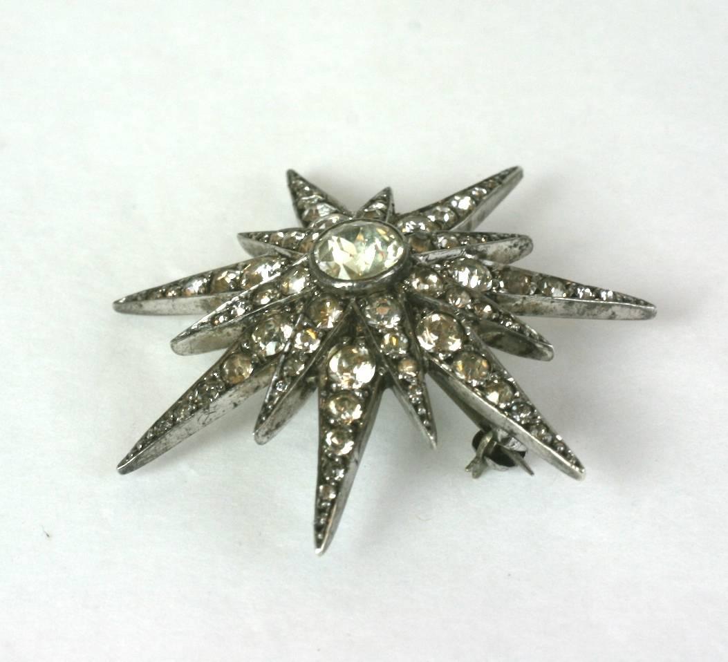 Edwardian paste starburst brooch circa 1900, the crystal paste vari size stones are set in sterling silver. 
Excellent Condition. 1.75