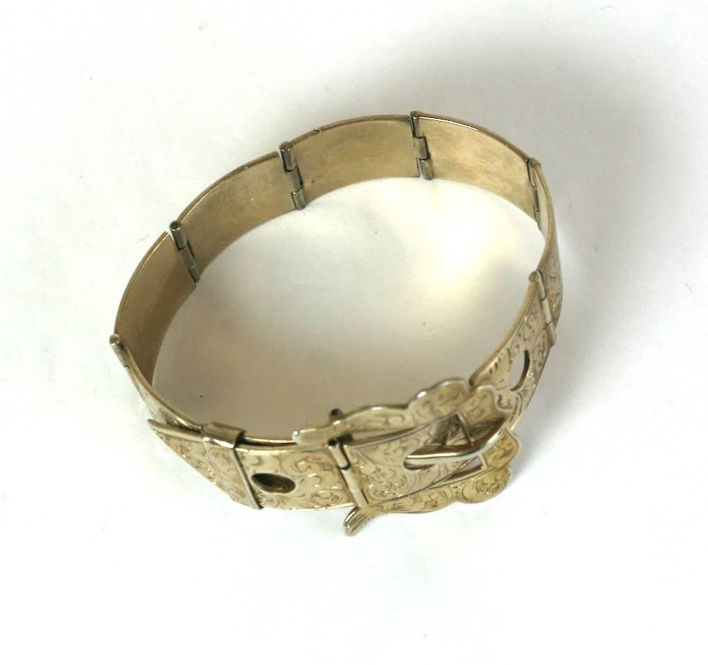 Victorian Etched Buckle Bracelet of gilt metal. Elaborate etched detailing throughout. 1880's USA. 
Fits smaller size to 6.25