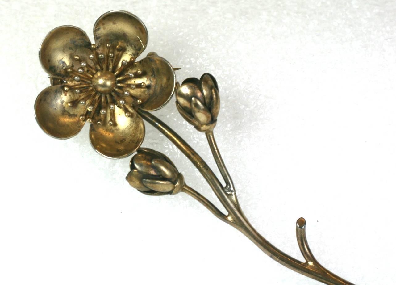 Victorian Japonesque Crysanthemum Brooch of gilded sterling. The fashion for things Japanese influenced many design movements in the later half of the 19th Century. This is an American made brooch in the Japonesque taste circa 1860.
Excellent