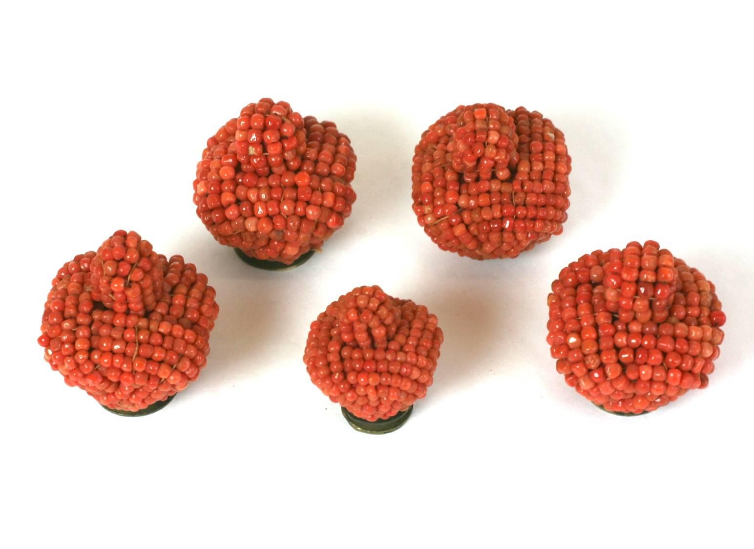 Set of Lovely Antique Chinese Coral Hat Finials from the 19th Century. Beautifully hand beaded and formed into a top knot for use as a hat finial. Fittings screw off base for attaching to fabric. 4 large and 1 small knot. 
Labeled 