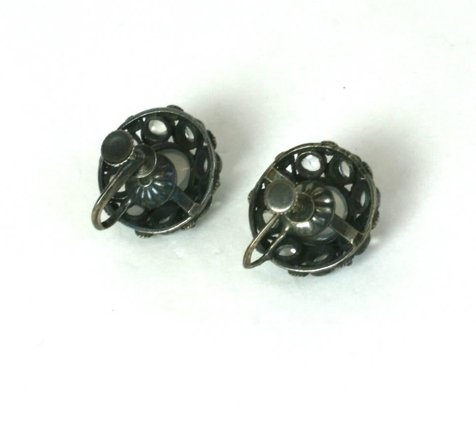 Lovely Moonstone Cabochon Earrings set in swirled silver settings with screw back fittings. High quality blue moonstones with good play of light. 1950's Italy. 
Excellent condition. .75". 