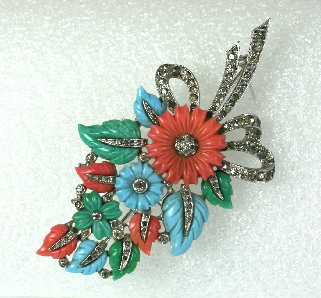Mazer Floral Spray brooch of faux jade, coral and turquoise molded glass pastel fruit salad flowers and leaves with crystal pave set into rhodium metal. 1930's USA. Unsigned. 
Excellent Condition.
Length 3 1/4