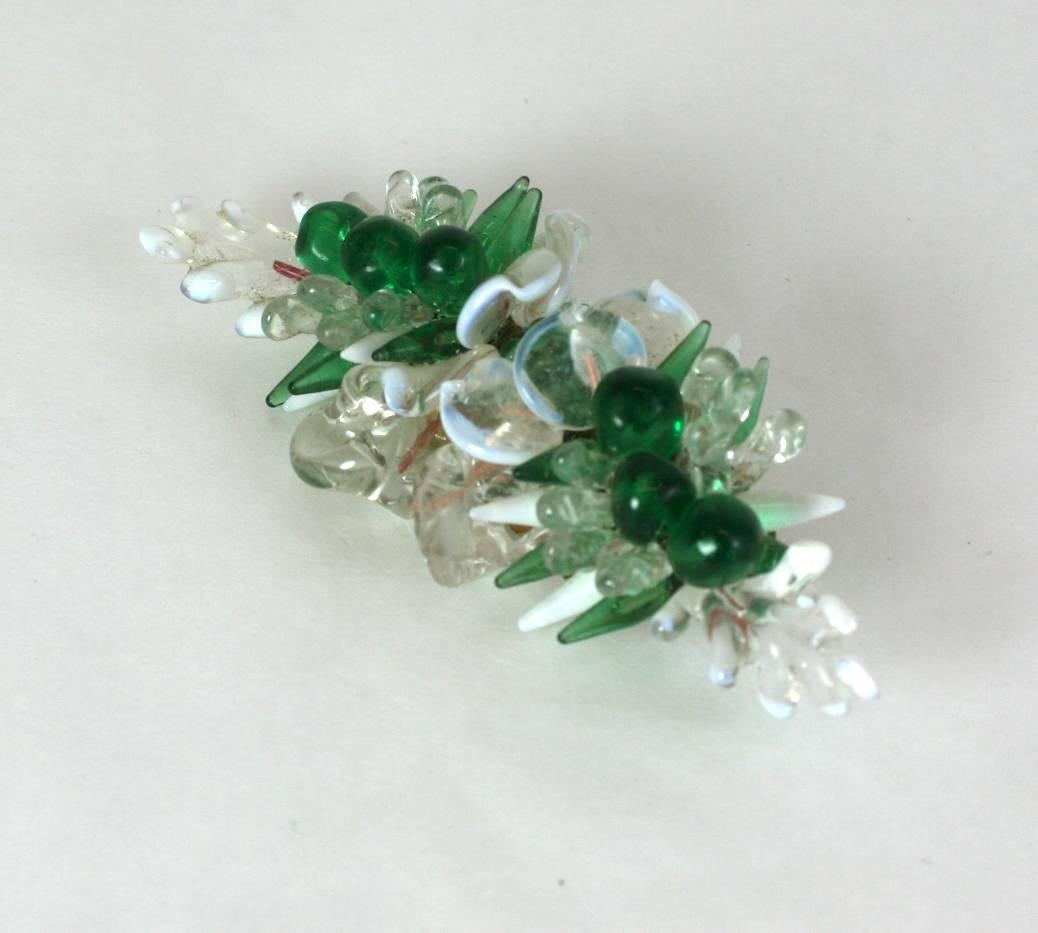 Lovely Louis Rousselet floral brooch of emerald and opal handmade lampwork flower heads and leaves. Hand wired onto a gilt metal  base.
Made in France. Excellent Condition. 1930's France. 
Length 3.50"
Width 1.50"