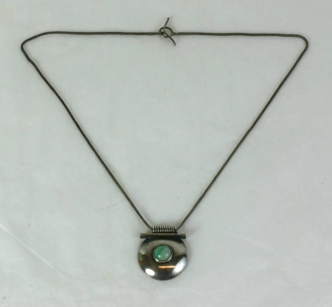 German Art Deco Machine Aged Amazonite Pendant. Super clean lines, with an amazonite cabochon centrally set in a half dome, mounted on a spiral bale. The hand woven, braided chain is really beautiful as is the elegant handle bar style