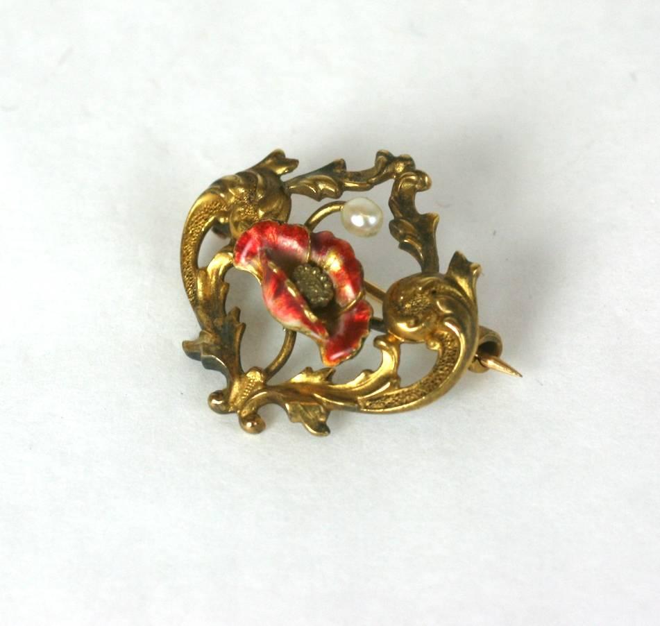 Charming Art Nouveau Poppy brooch in 14k gold with transluscent matte enamel and natural pearl, circa 1890.
Newark, New Jersey manufacture. 
Excellent Condition, with minor flake to enamel on poppy. 
Length .75"
Width 75"