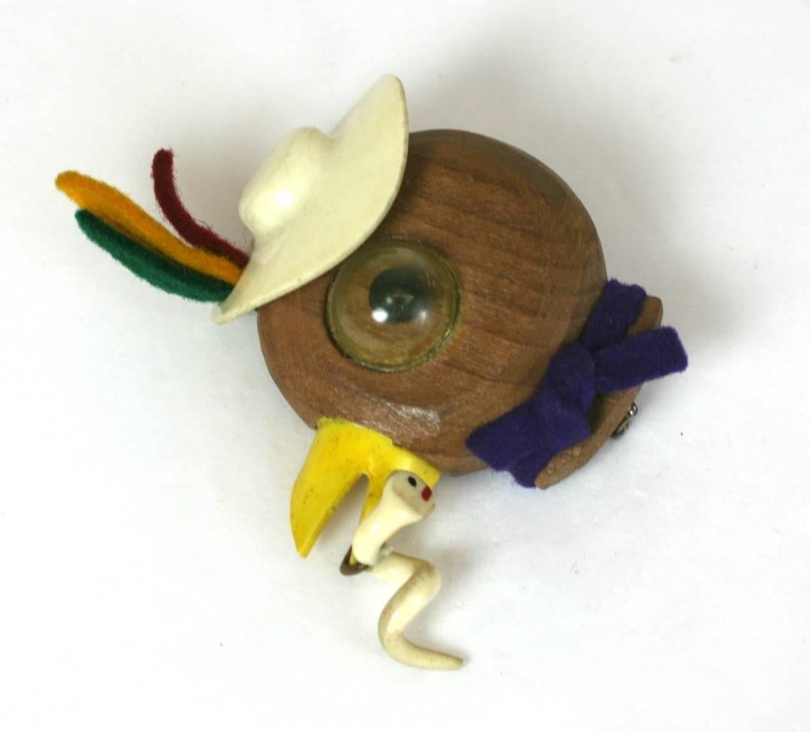 Charming Art Deco Bird Brooch of carved wood with celluloid hat and felt accents. 
Adorable with dangling celluloid worm in beak. Googly eye has a black bead pupil under a celluloid dome. 
Wonderful, happy cartoon brooch, 1930's American Folk Art,