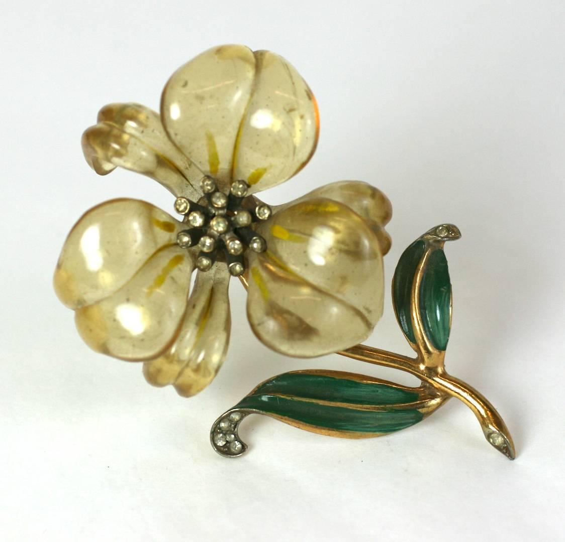 Wonderful Art Deco Lucite Lily Brooch from the 1930's. Massive lucite flower head is cold painted and mounted on an enameled white metal branch with pave rhinestone accents. Large scaled, charming figurative jewelry, popular in the 1930's.
Excellent