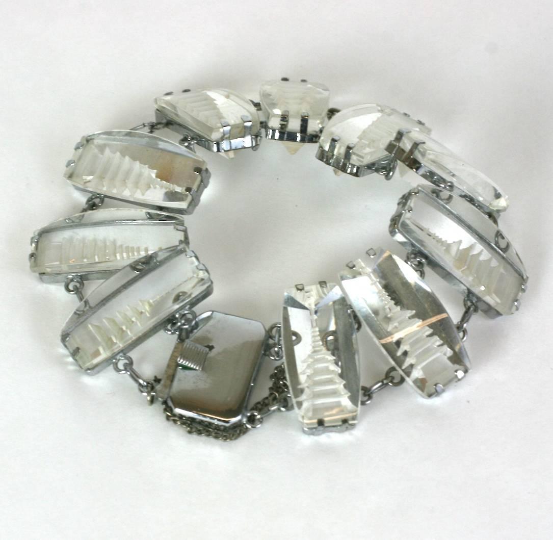 Japanese Sterling and Crystal Pagoda Bracelet from the 1950's. Each glass stone has a reverse carved pagoda design on the back and is set into pronged sterling settings. Glass panels are curved on top for interesting optical depth.
 1950's Japan.