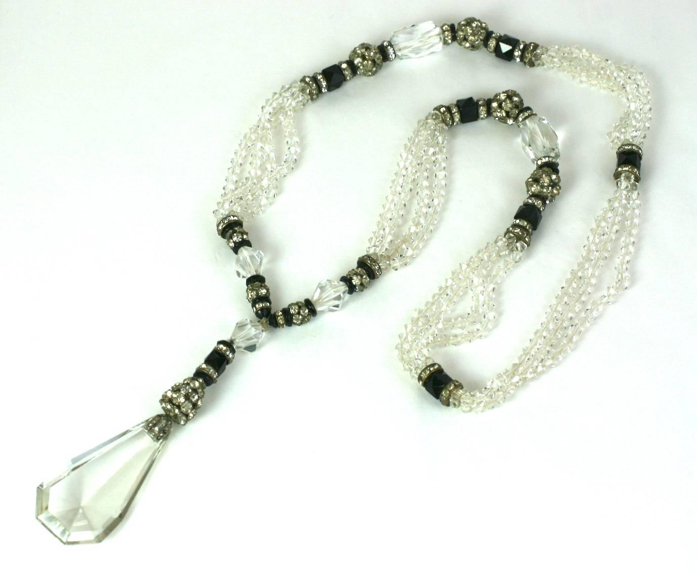 Elaborate and dramatic French Art Deco crystal, jet ,and crystal paste sautoir pendant necklace. With large focal faceted crystal and paste drop set in silver gilt with pave rondel accents.  1920's France.  Excellent Condition. 
L 30" 
L 