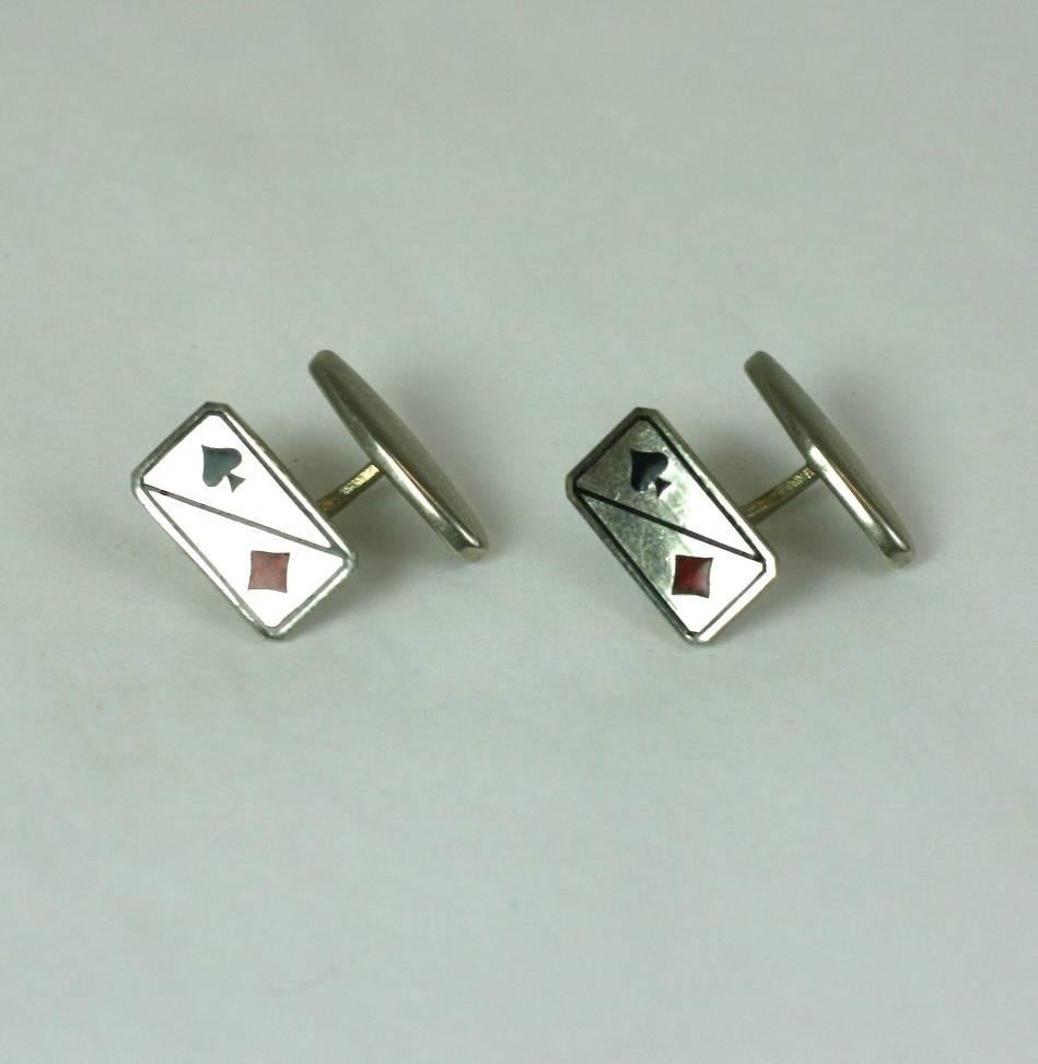 Art Deco hard enamel black spades and red diamonds cuff links set in silver plated metal with oval toggle shank. 
1920's France. Excellent Condition. 
L 11/16