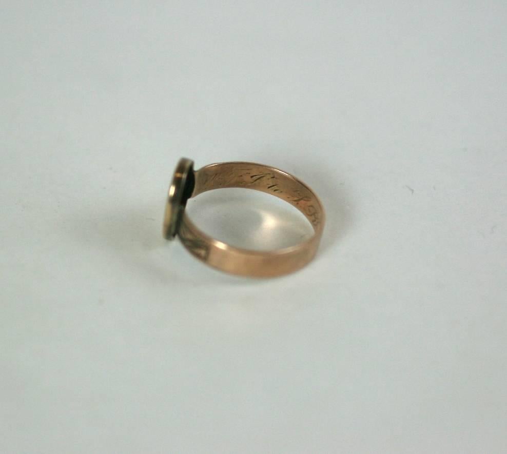 Attractive Victorian Signet Ring from the mid 19th Century. Fashioned of 10k rose gold with elaborate, large 