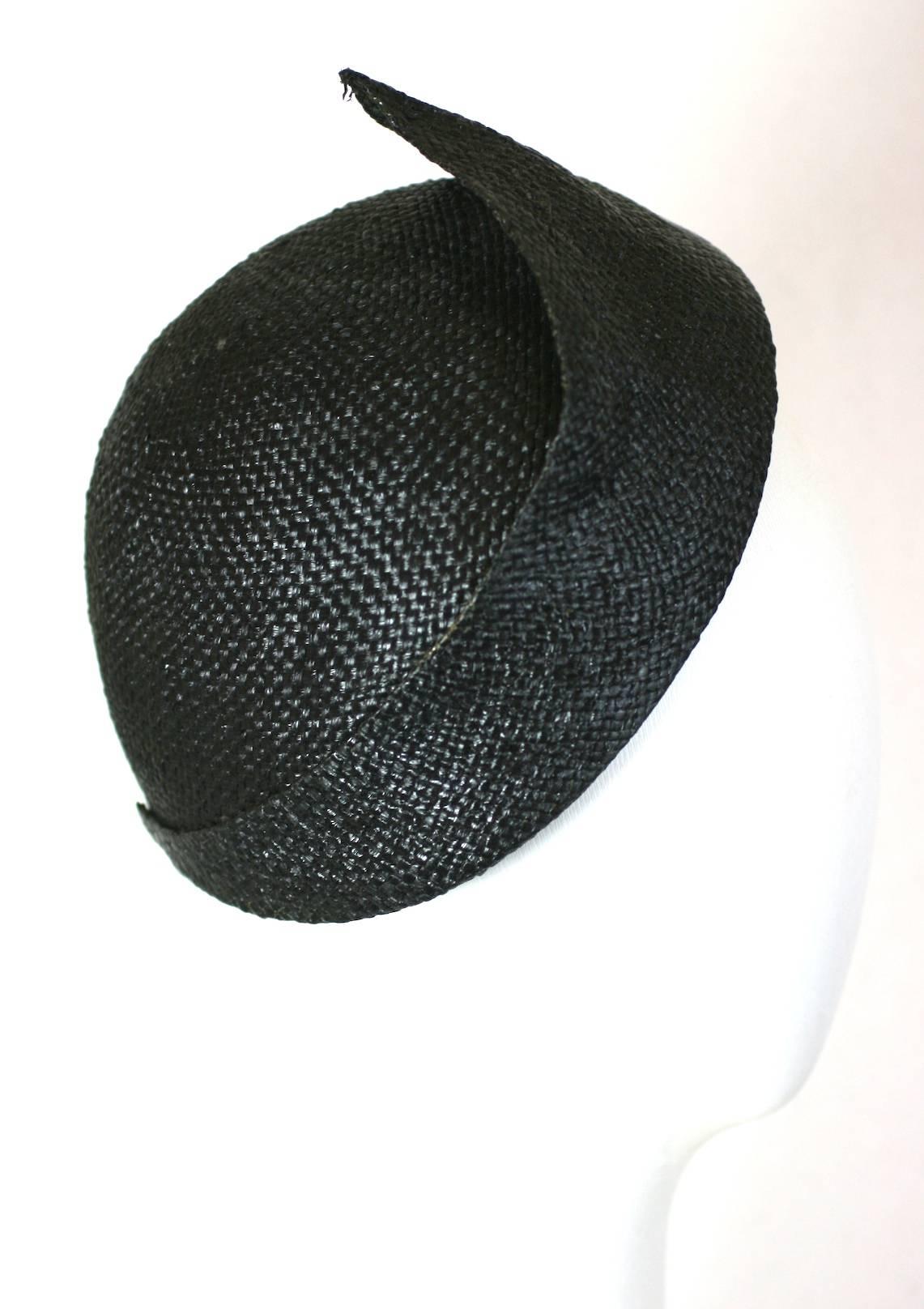 Lanvin Haute Couture  woven straw cloche hat designed by Claude Montana. The hat is inspired by an Art Deco Jeanne Lanvin cloche hat from the 1920s.
Labelled, Lanvin, France 1980's.
Excellent Condition.
Circumference at forehead 22