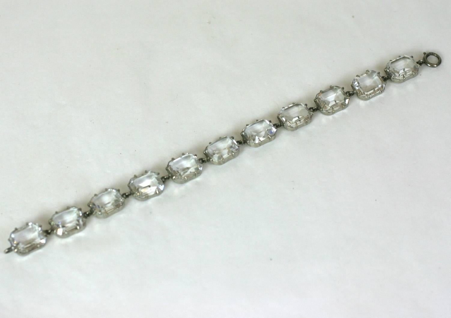 Art Deco Crystal Paste silver gilt metal bracelet of faceted rectangular crystals, prong set in Georgian style settings. 
1920's France. Excellent Condition. 
Length 7.50