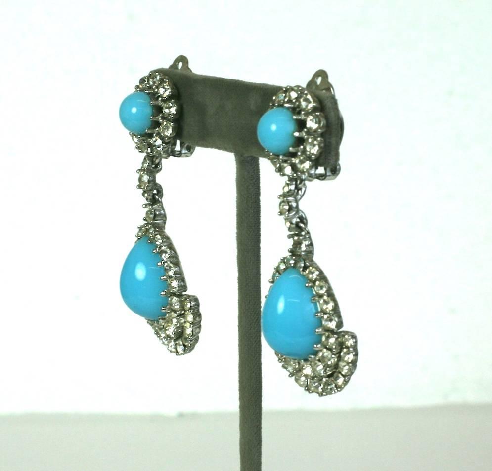 Glamorous Ciner Pendant earclips of silvered metal set with faceted crystal pastes around vari shaped faux Persian turquoise cabochons.
Excellent Condition. 1960's USA. Clip back fittings.
Length 2.50