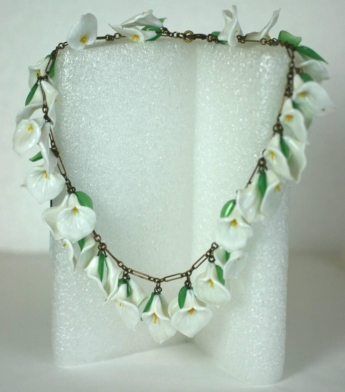 Antique Italian lampwork glass Calla Lily necklace circa 1930. Composed of hand made, milk glass naturalistic flower heads and tiny green leaves. Lovely, delicate craftsmanship, perfect for a summer wedding.  1930's Italy. 
Excellent
