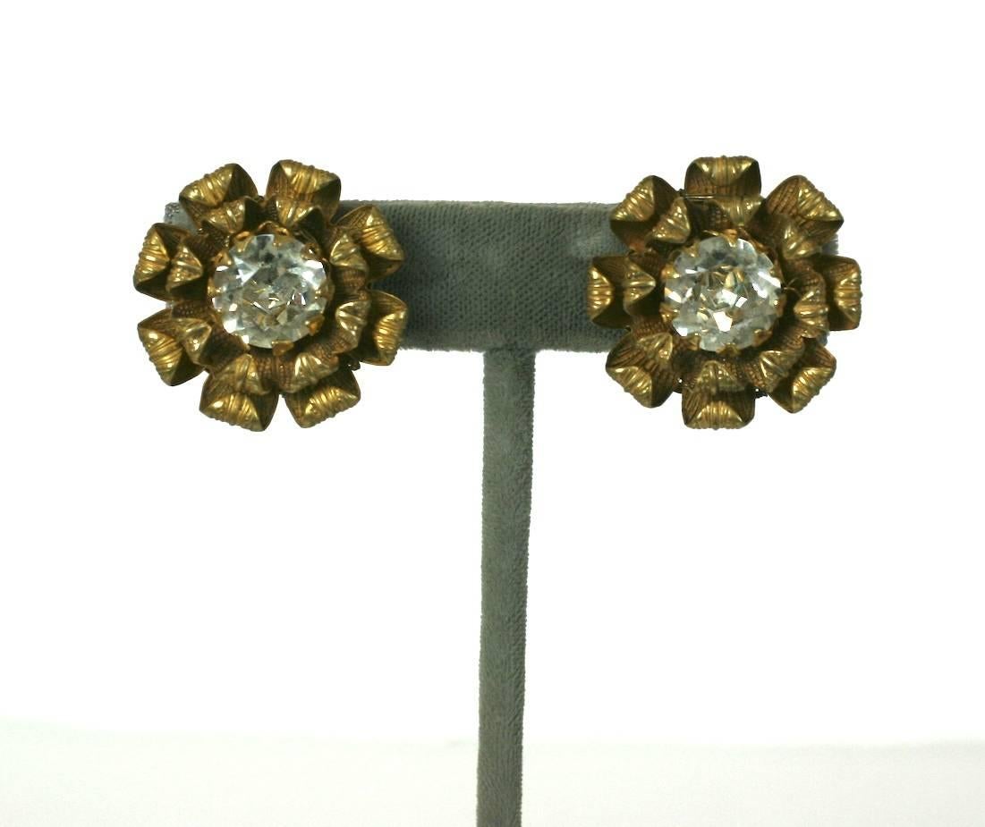 Miriam Haskell signature Russian gilt curled petal flower head ear clips. Each is set with a large faceted crystal paste center stone. Clip Back Fittings.
Excellent Condition. 1950's USA. 
Length 1"
