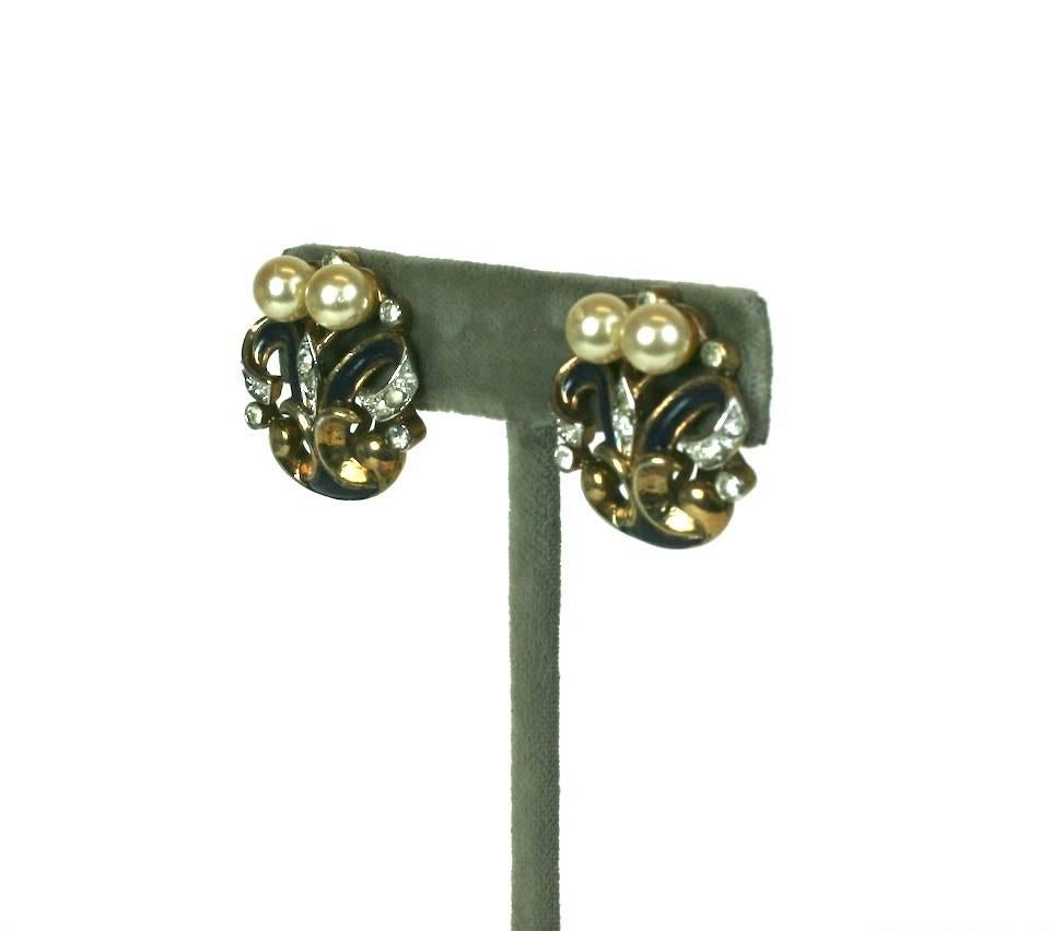 Trifari Eugenie Series Earclips from the 1940's. Signature enameled swirls are mixed with faux pearls and pave in this 