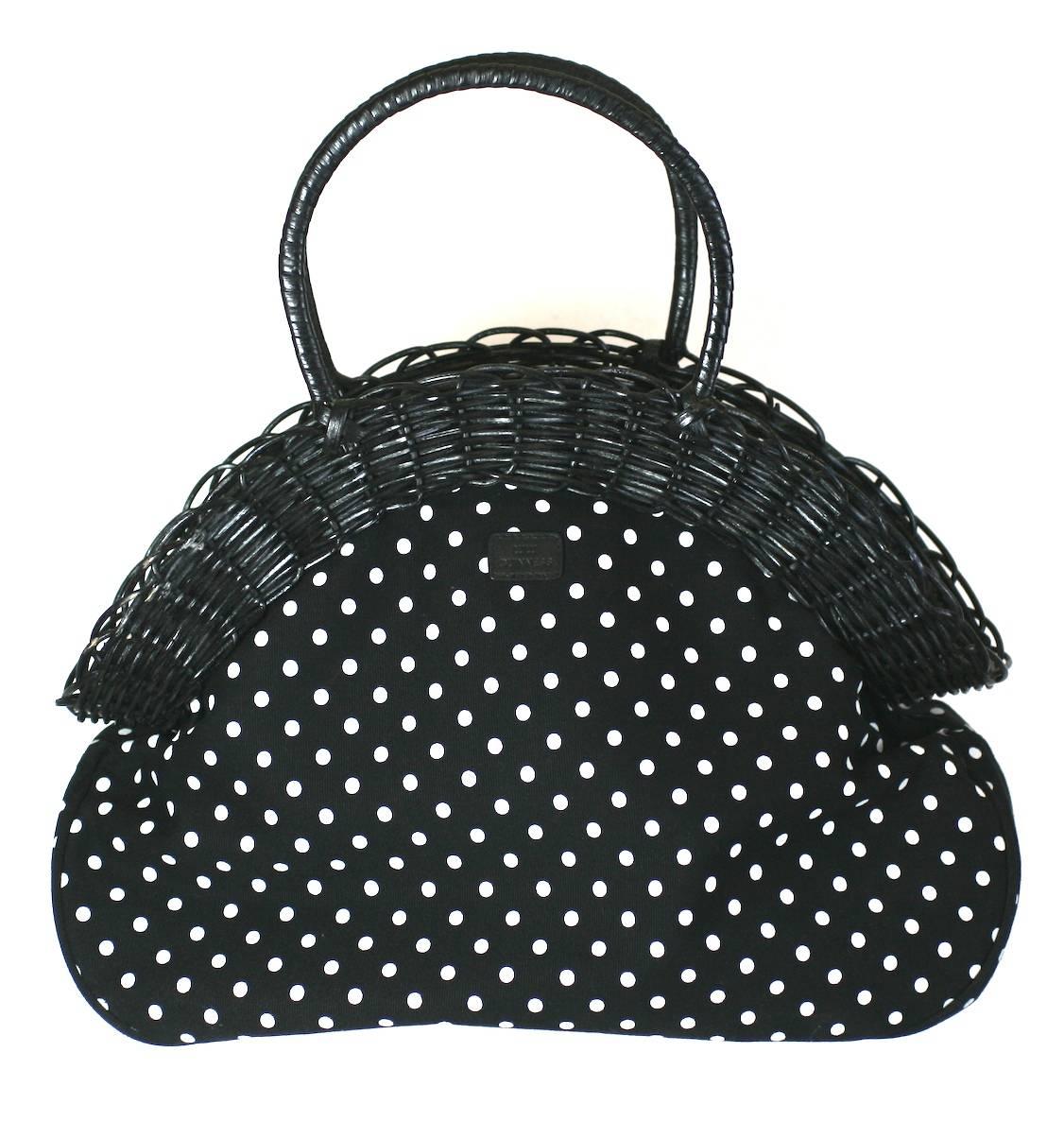 Lulu Guinness Wicker Framed, Lemon decorated bag on a polka dot canvas base. Whimsical charming design as to be expected from Lulu Guinness.
A wide wicker frame and handles hide a central zip compartment with more pockets inside.
16" wide x