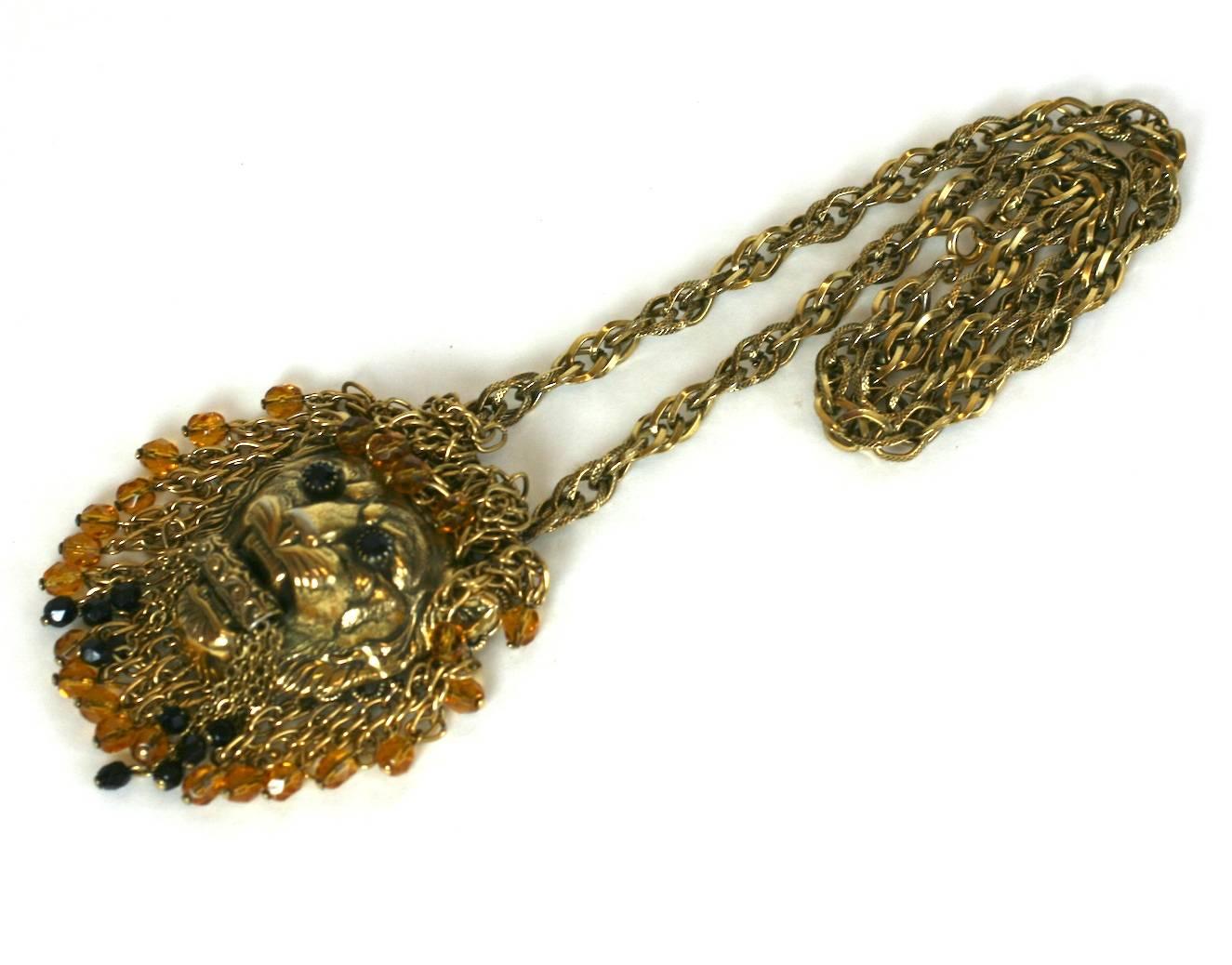 Striking gilt lion head necklace, the lions mane embellished in gilt chain with topaz and jet faceted crystals. The lions eyes of jets elaborately prong set. Necklace of rope gilt chain. Excellent Condition. 1960's USA. 
Length 25
